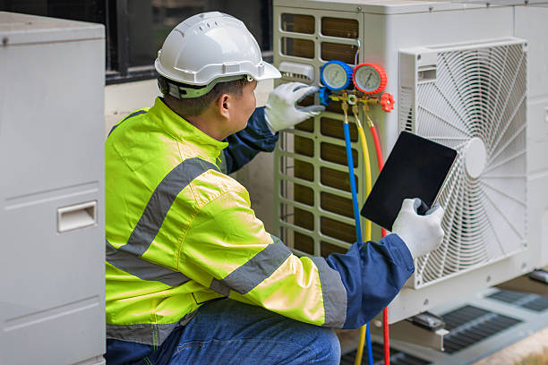Professional Air Conditioning Repair technician working in Burnips, MI